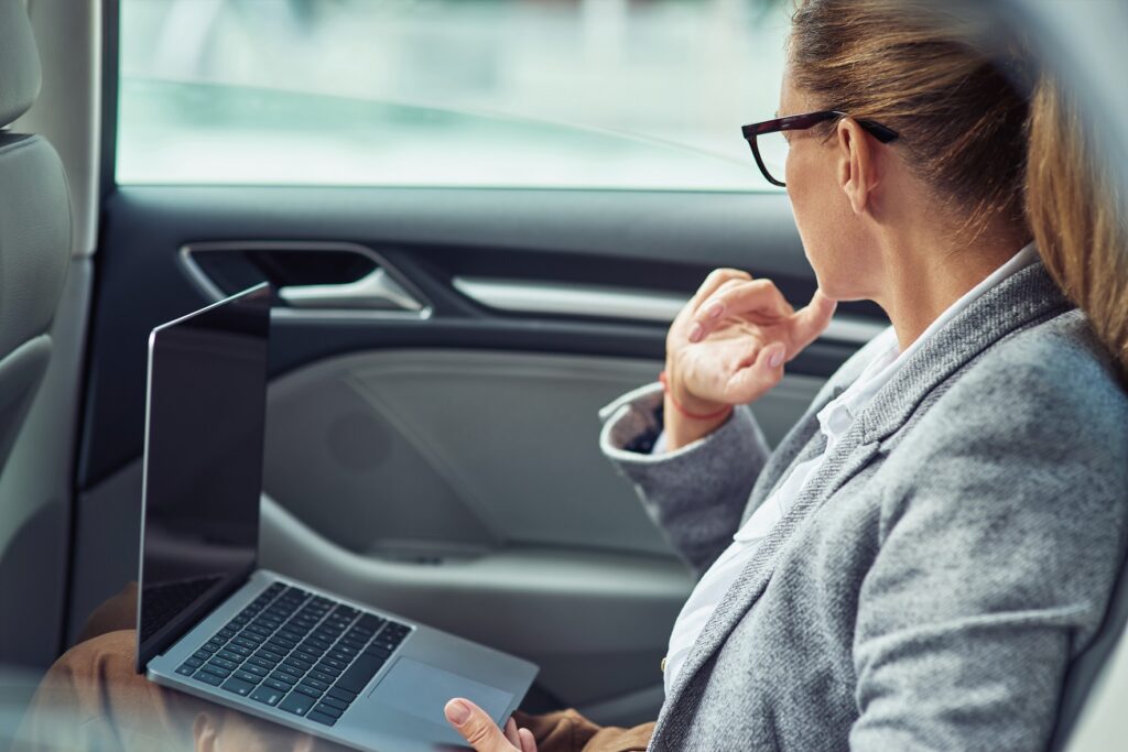 6 Reasons Why Limo's are Perfect to take for Business Meetings - working on the way to the office side view of a t 2022 02 09 15 50 19 utc , business meetings