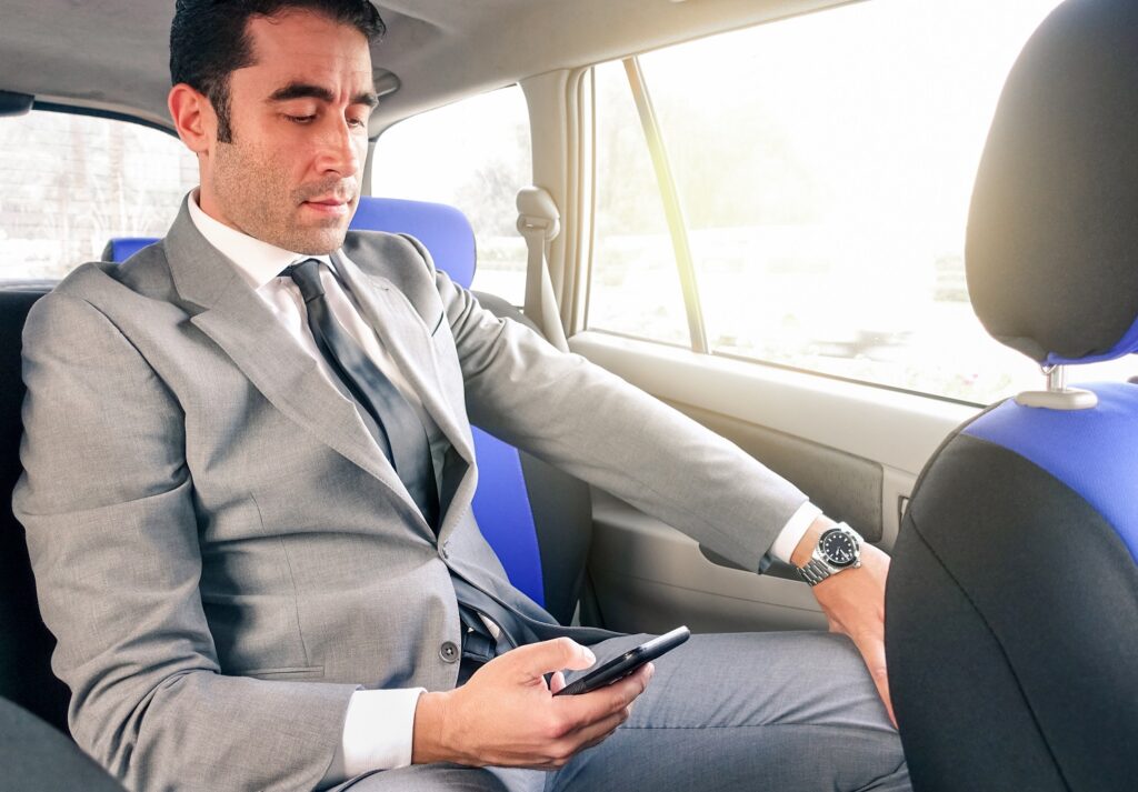 5 Advantages of Taking a Limo to the Airport - young handsome businessman sitting in taxi cab usi 2022 12 09 04 45 07 utc , airport